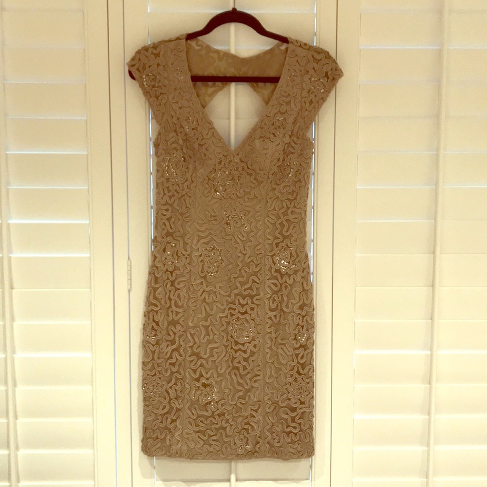 Gold backless dress by Sue Wong.